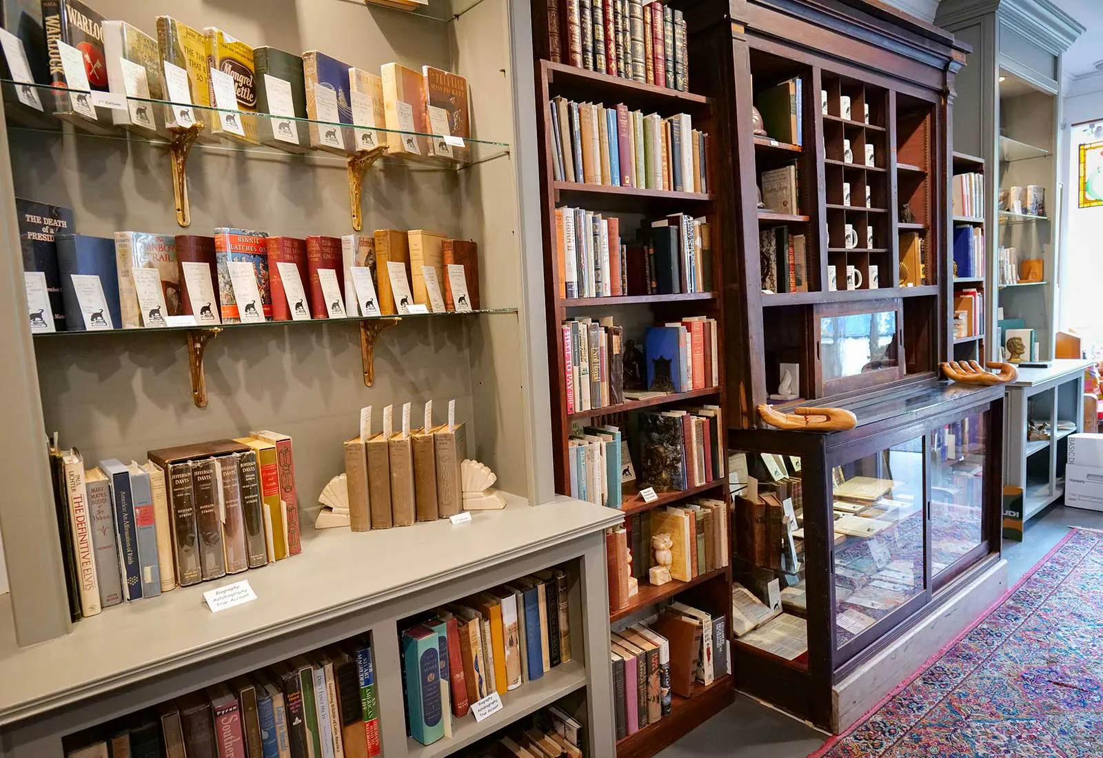 Used and rare books in Savannah – Books on Bay Bookcases lined with collectible books at Books on Bay, a used and rare bookstore in Savannah, GA
