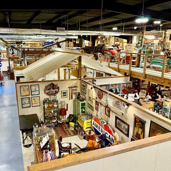 Vendor booths, vintage signs and furniture seen from the mezzanine of Picker Joe's Antique Mall in Savannah, GA