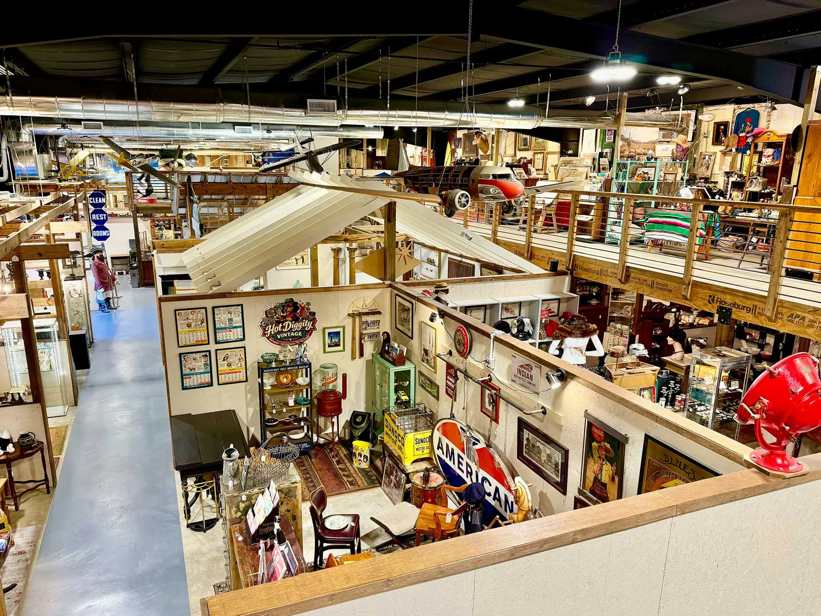 Savannah antiques - Picker Joe’s Antique Mall Vendor booths, vintage signs and furniture seen from the mezzanine of Picker Joe's Antique Mall in Savannah, GA